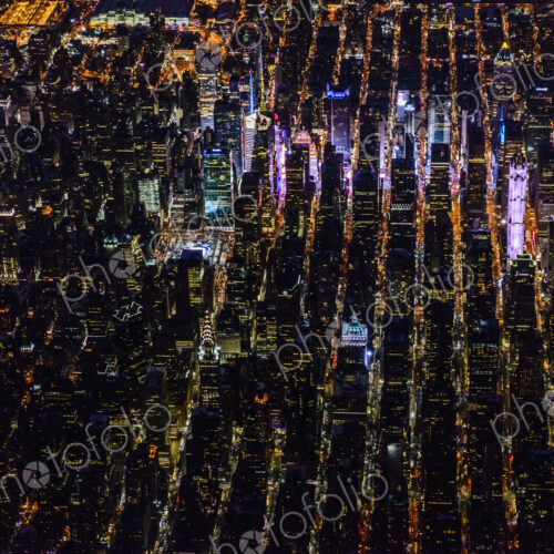 The city of New York City, Manhattan, aerial view at night. The city of New York City, Manhattan, aerial view at night.