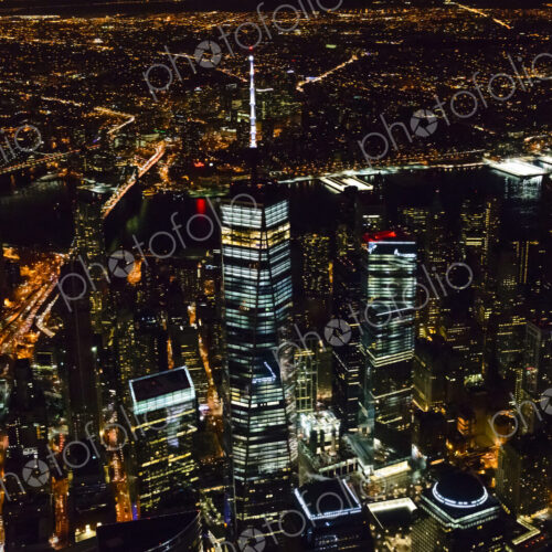 The city of New York City, Manhattan, aerial view at night. The city of New York City, Manhattan, aerial view at night.
