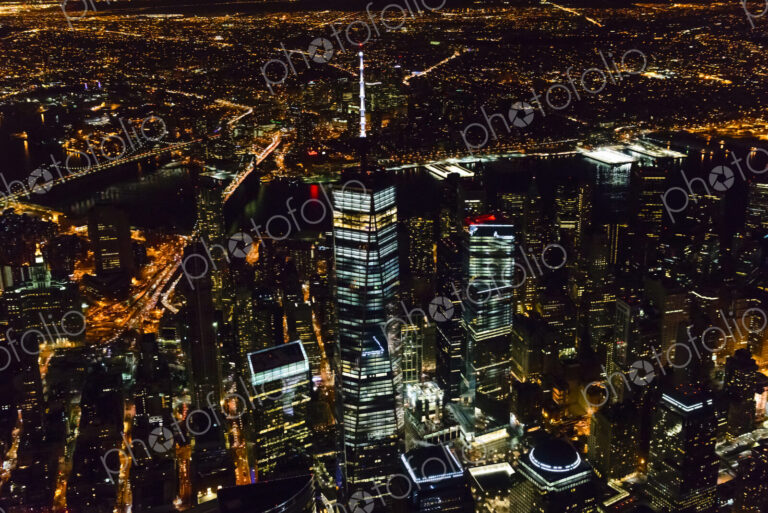 The city of New York City, Manhattan, aerial view at night.