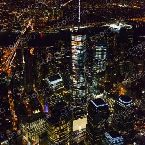 The city of New York City, Manhattan, aerial view at night.