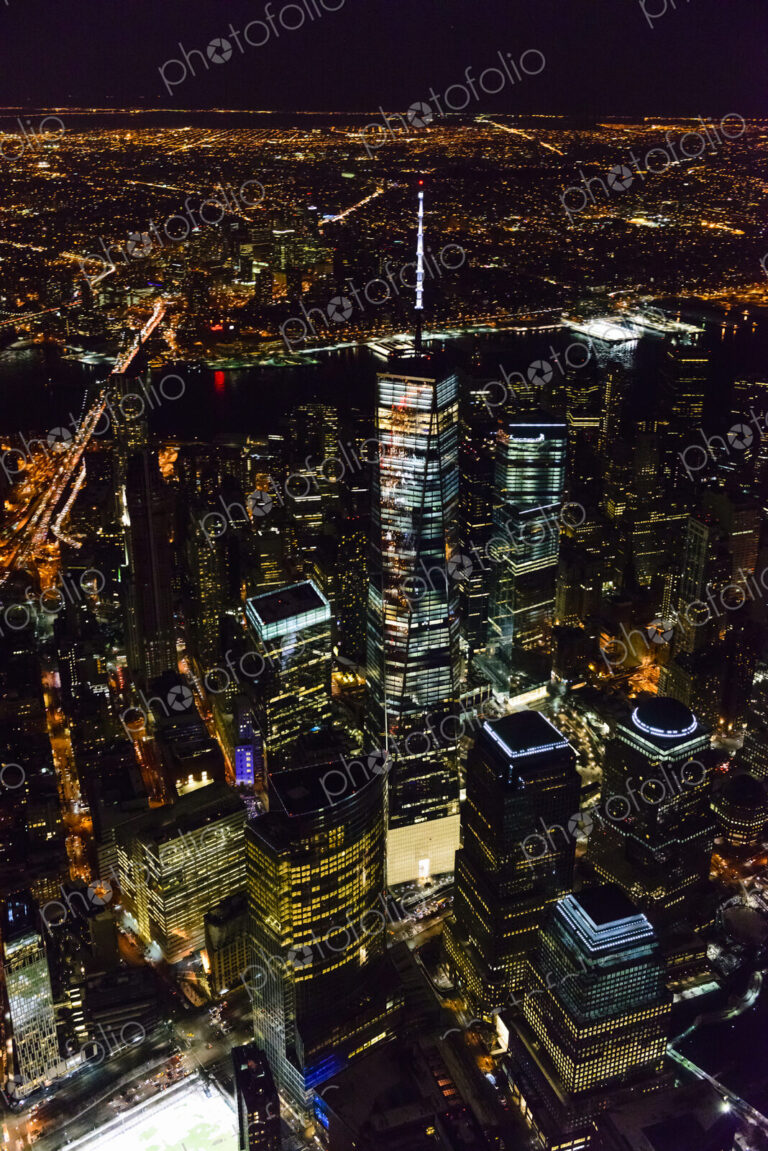 The city of New York City, Manhattan, aerial view at night.