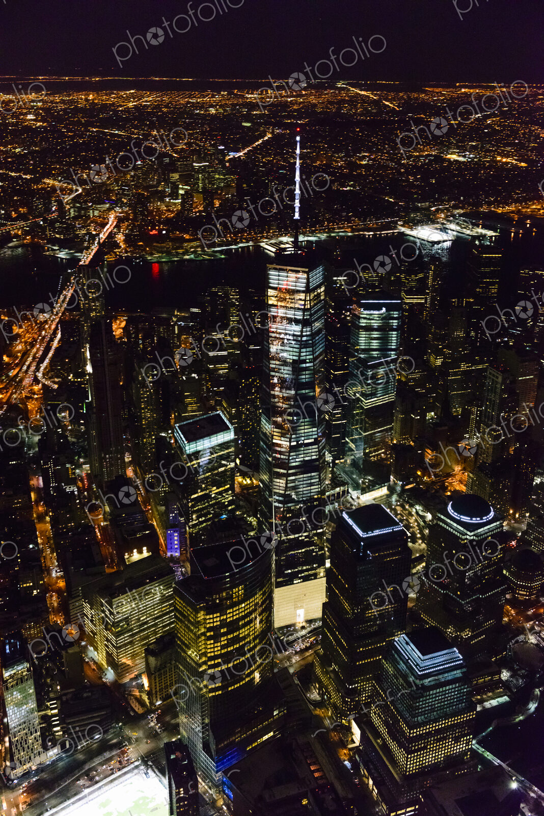 The city of New York City, Manhattan, aerial view at night.