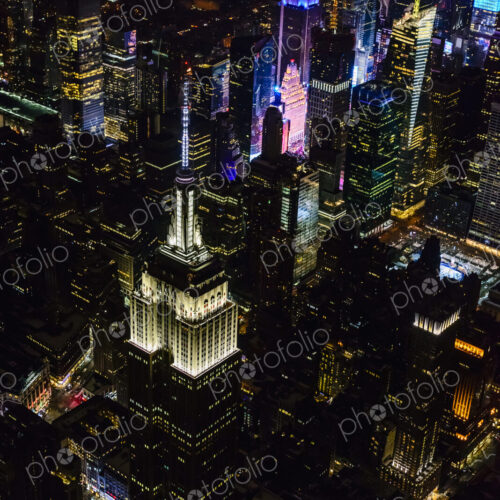 The city of New York City, Manhattan, aerial view at night.
