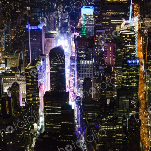 The city of New York City, Manhattan, aerial view at night.
