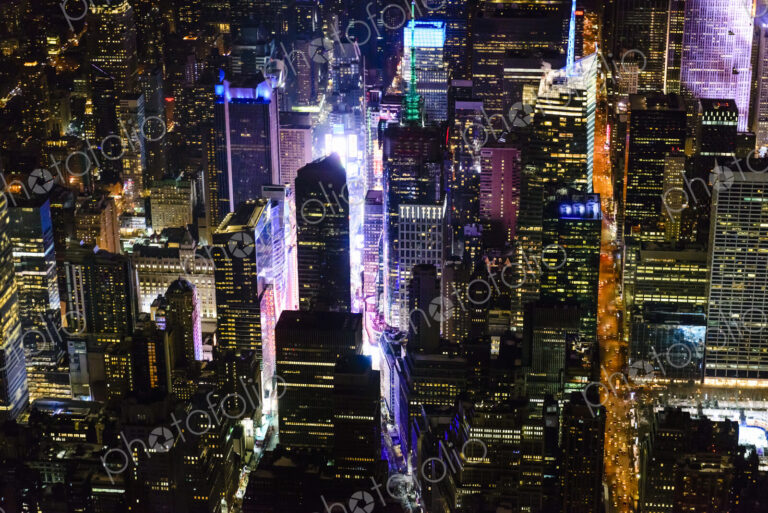 The city of New York City, Manhattan, aerial view at night.