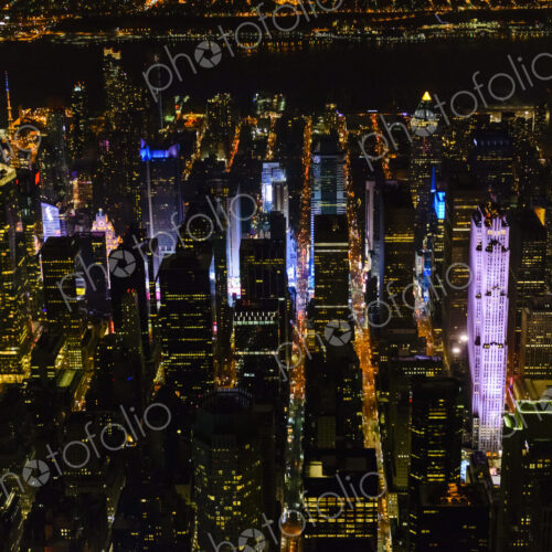 The city of New York City, Manhattan, aerial view at night. The city of New York City, Manhattan, aerial view at night.