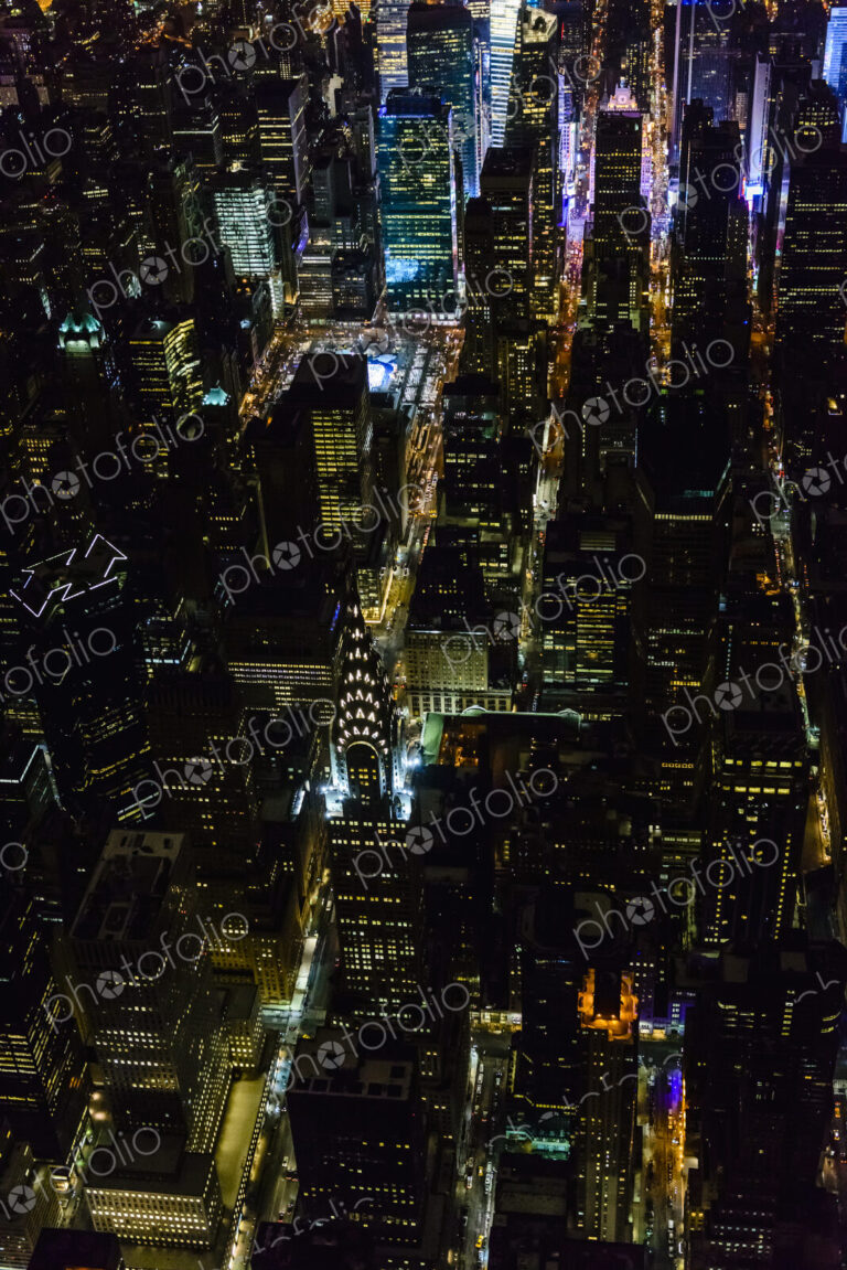 The city of New York City, Manhattan, aerial view at night.