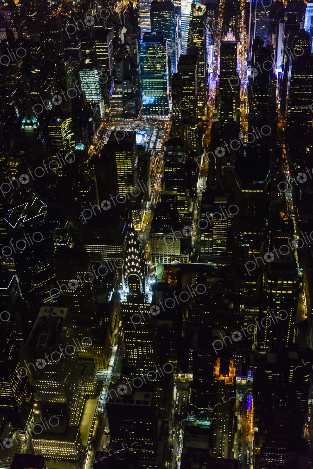 The city of New York City, Manhattan, aerial view at night.