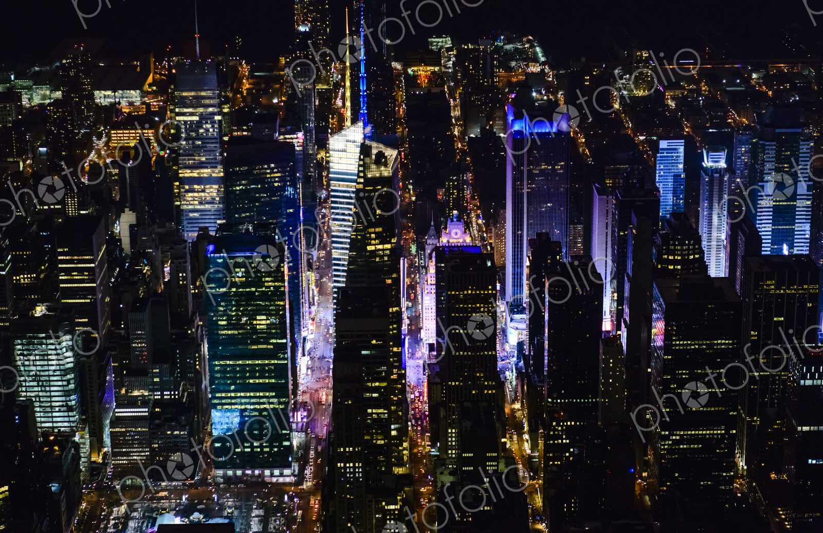 The city of New York City, Manhattan, aerial view at night.