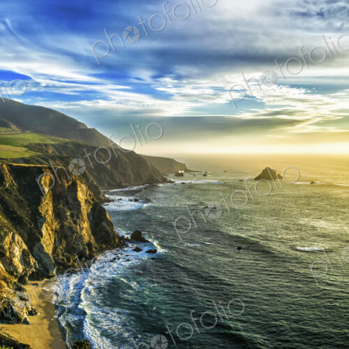 The coastline at Big Sur in california, with steep cliffs and rock stacks in the… The coastline at Big Sur in california, with steep cliffs and rock stacks in the…