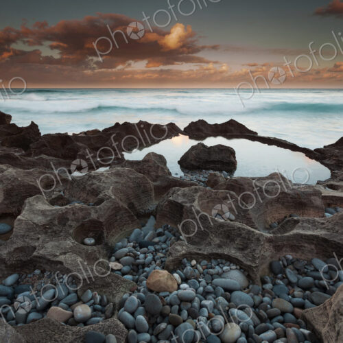 The coastline, bays and cliffs on Cape Agulhas near Arniston at sunset. The coastline, bays and cliffs on Cape Agulhas near Arniston at sunset.