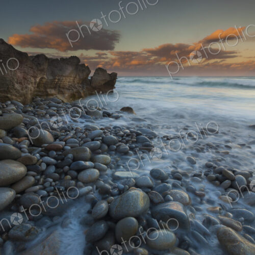 The coastline, bays and cliffs on Cape Agulhas near Arniston at sunset. The coastline, bays and cliffs on Cape Agulhas near Arniston at sunset.