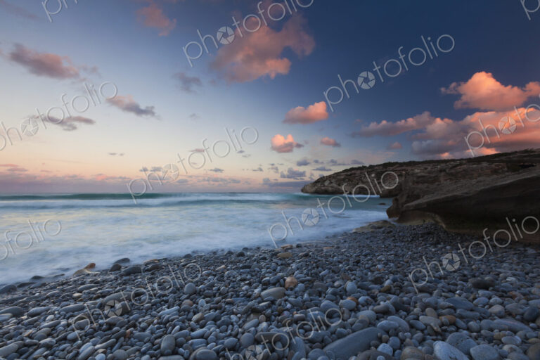 The coastline, bays and cliffs on Cape Agulhas near Arniston at sunset.