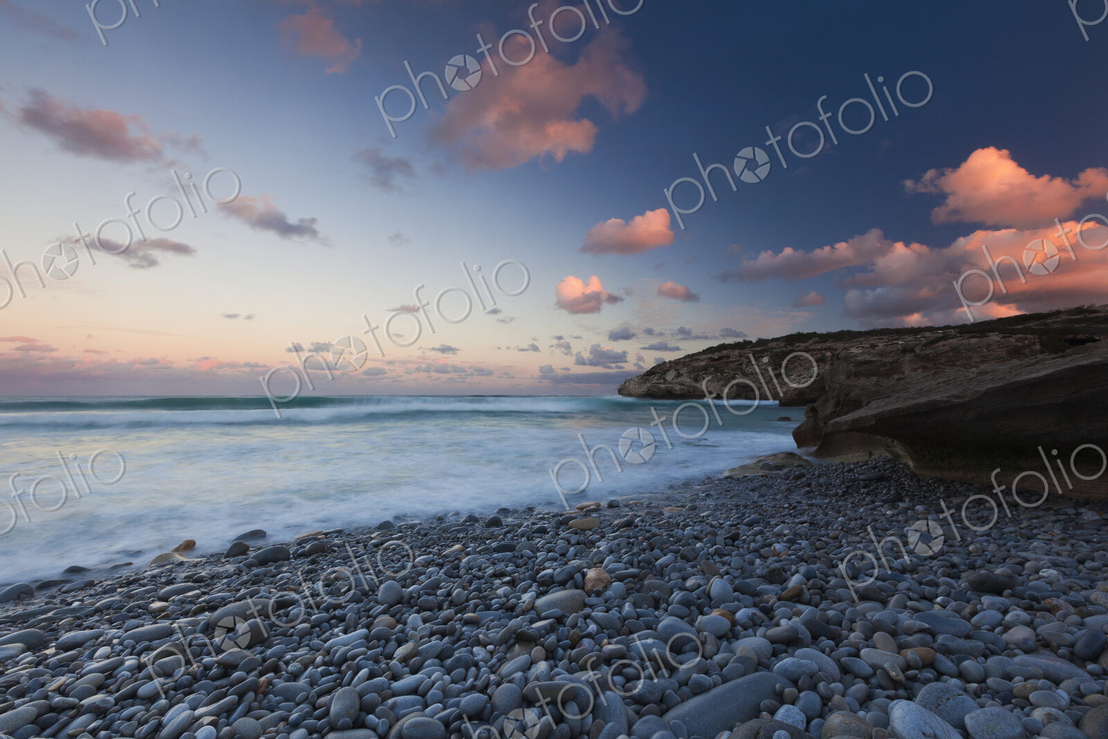 The coastline, bays and cliffs on Cape Agulhas near Arniston at sunset.