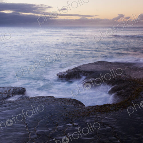 The coastline of Arniston, on Cape Agulhas, with the sun setting. The coastline of Arniston, on Cape Agulhas, with the sun setting.