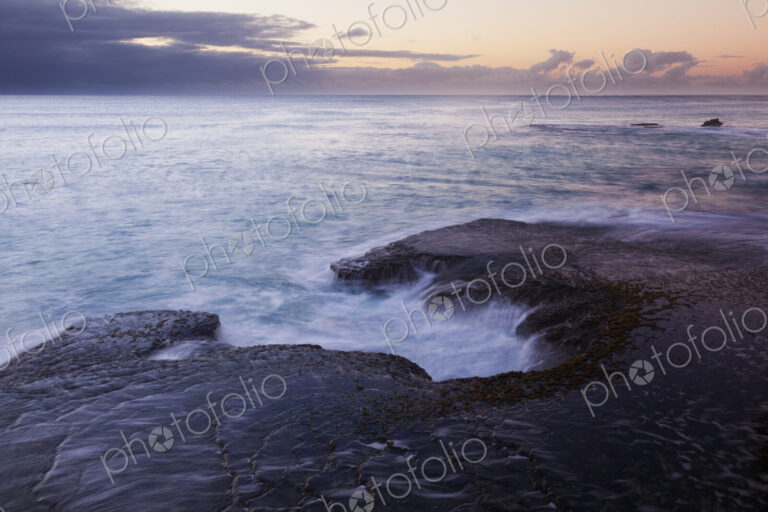 The coastline of Arniston, on Cape Agulhas, with the sun setting.