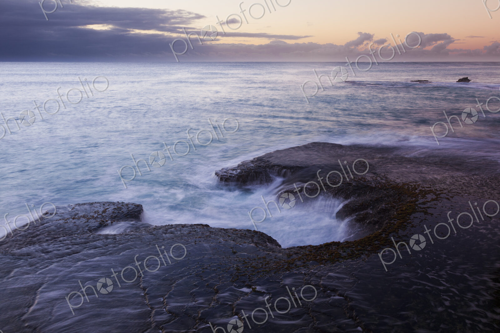 The coastline of Arniston, on Cape Agulhas, with the sun setting.