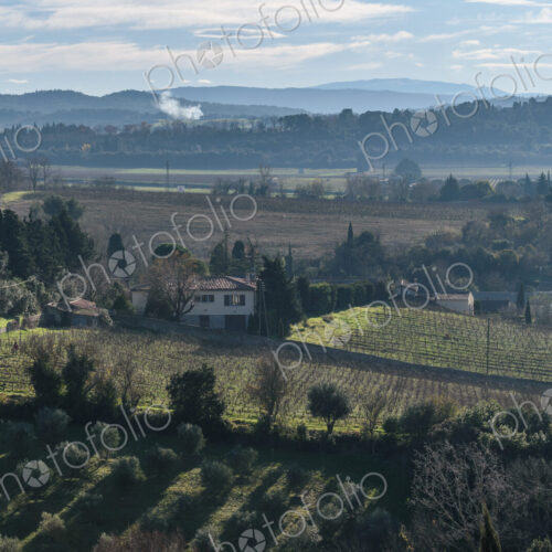 The elevated view over the countryside, fields and farmland and hills in the distance. The elevated view over the countryside, fields and farmland and hills in the distance.
