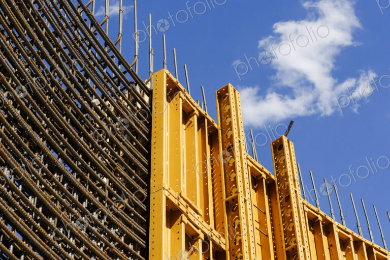 The exterior of a construction site, a high rise building, rebar concrete shuttering…