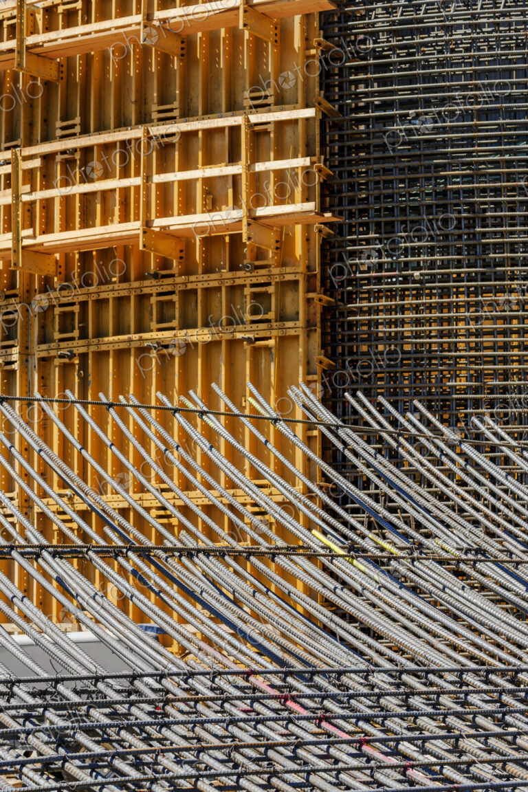 The exterior of a construction site, a high rise building, rebar concrete shuttering…