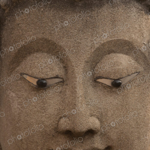 The face of a statueof the Buddha in Ayutthaya Historical Park, Thailand The face of a statueof the Buddha in Ayutthaya Historical Park, Thailand