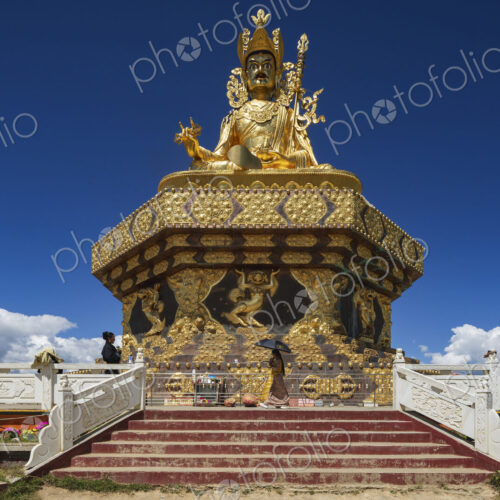 The giant Buddha at Yarchen Gar rises serenely over the vast monastic settlement in…