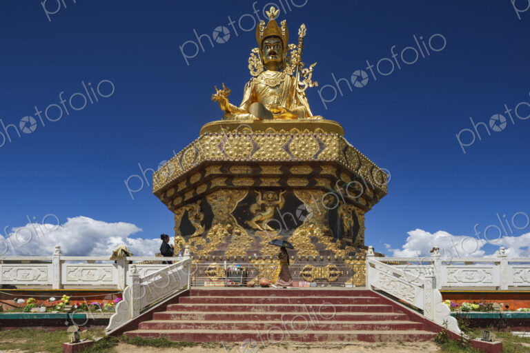 The giant Buddha at Yarchen Gar rises serenely over the vast monastic settlement in…