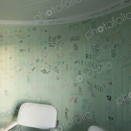The graffiti on the walls of a lighthouse, an empty room with a chair, drawings and… The graffiti on the walls of a lighthouse, an empty room with a chair, drawings and…
