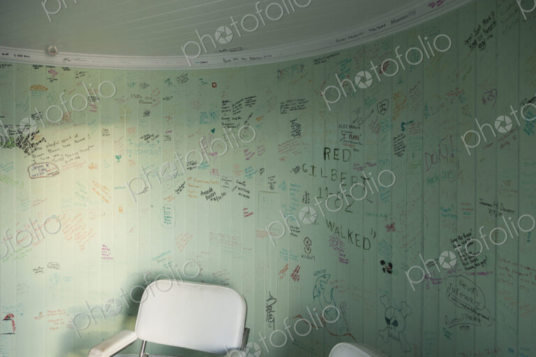 The graffiti on the walls of a lighthouse, an empty room with a chair, drawings and…