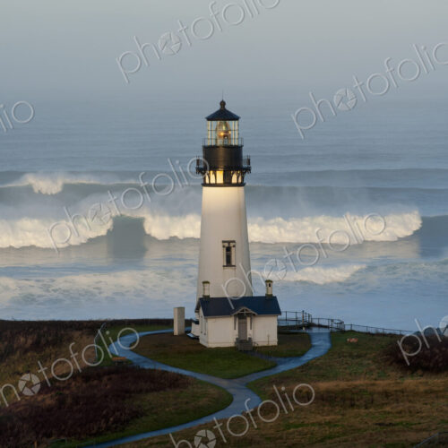 The historic Yaquina Head tower lighthouse on a headland overlooking the Pacific… The historic Yaquina Head tower lighthouse on a headland overlooking the Pacific…