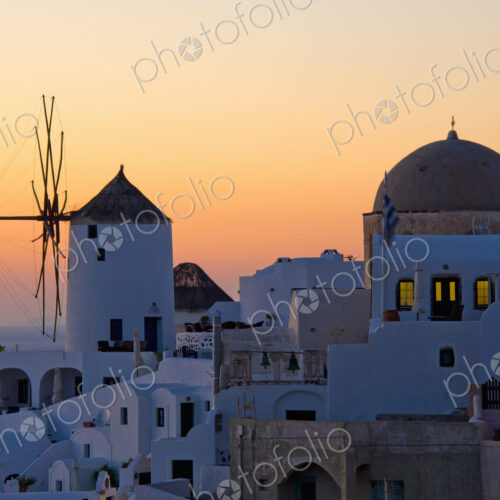 The historic white washed houses, windmills and domed church of Oia town on Santorini… The historic white washed houses, windmills and domed church of Oia town on Santorini…