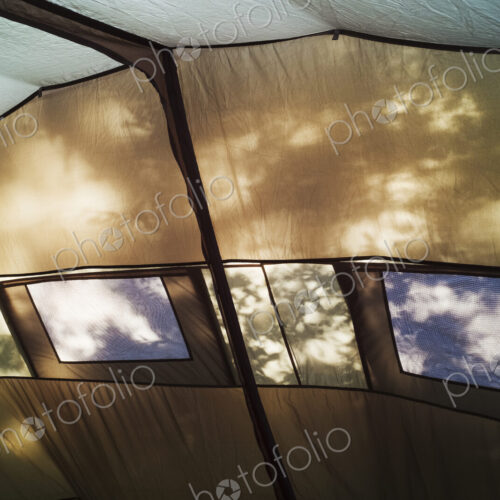 The interior of a large tent, roof and walls, windows and interior framework. Sunlight… The interior of a large tent, roof and walls, windows and interior framework. Sunlight…