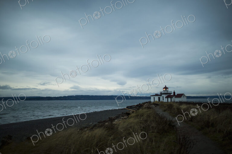 The lighthouse at dusk at Discovery Park in Seattle, WA.