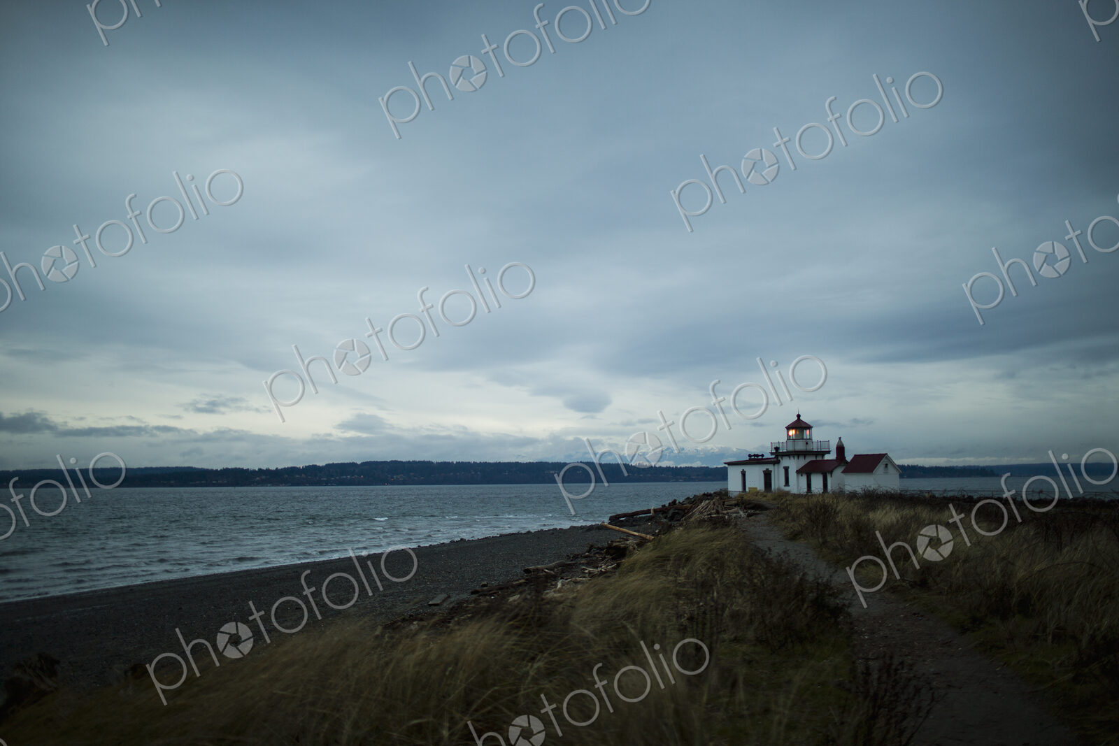 The lighthouse at dusk at Discovery Park in Seattle, WA.