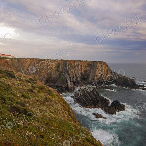 The lighthouse on the headland on the Atlantic coastline. The lighthouse on the headland on the Atlantic coastline.