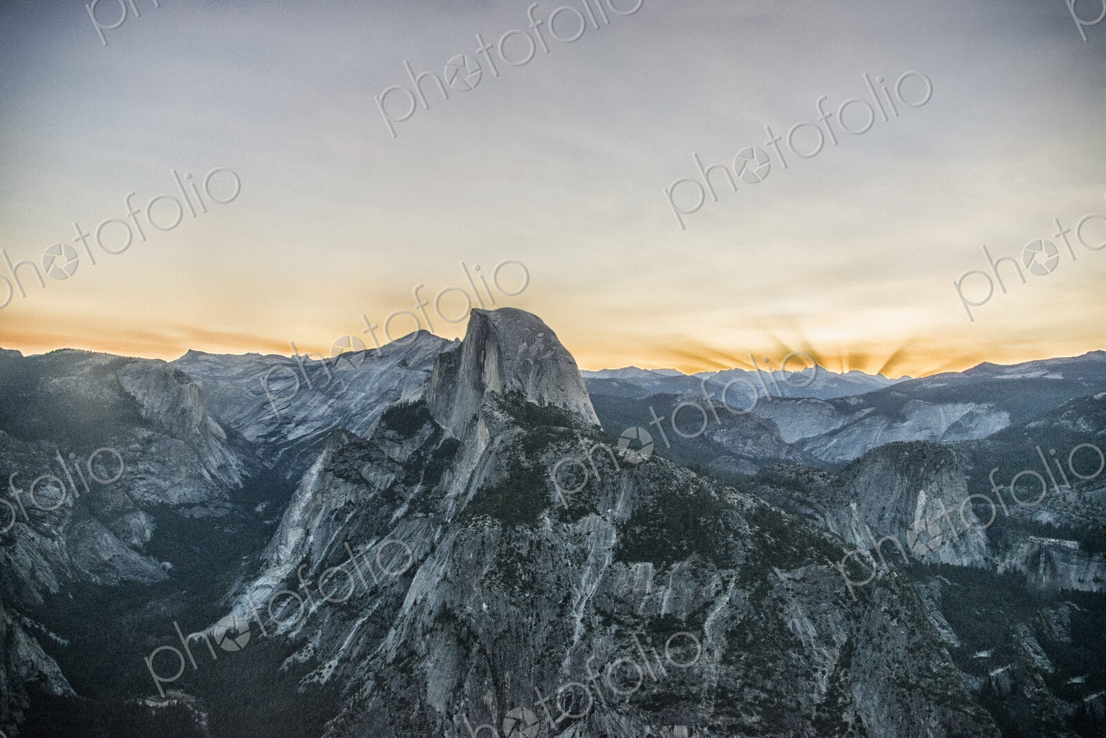 The mountain range in Yosemite valley at sunset. The Half Dome landmark