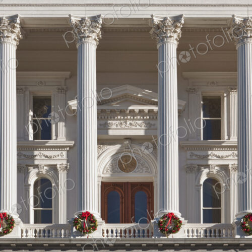 The neoclassical California State Capitol Building at Christmas time, wreaths on each…