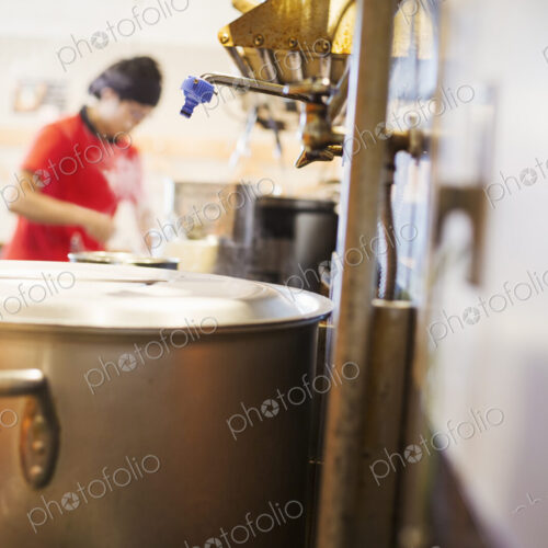 The ramen noodle shop. A chef working in a kitchen.