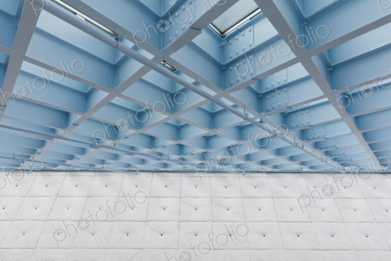 The roof of a building, a grid pattern and turquoise blue lights and sprinklers, fire…