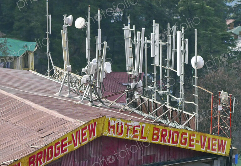 The roof of the hotel Bridge-View in Shimla, with large communications masts, mobile…