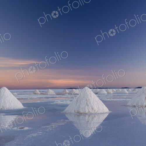 The salt pans of Salar de Uyuni, with shallow water and mineral deposits. White salt… The salt pans of Salar de Uyuni, with shallow water and mineral deposits. White salt…