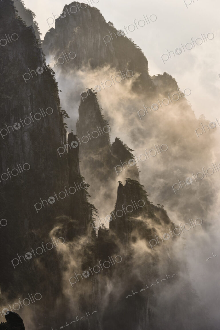 The steep jagged granite peaks of the Huangshan Mountains, the Yellow Mountains, mist…