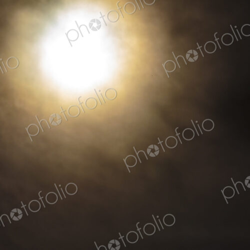The sun, blurred and behind clouds, USA The sun, blurred and behind clouds, USA