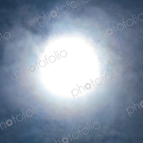 The sun, blurred and behind clouds, USA The sun, blurred and behind clouds, USA