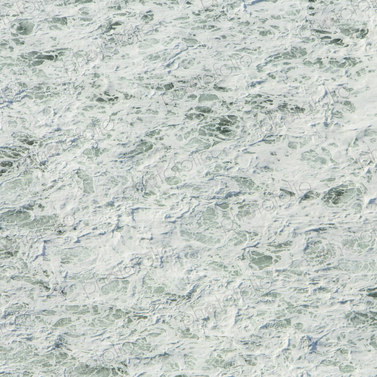 The surface of the Pacific ocean with wave patterns and white water, at Manzanita, Oregon.