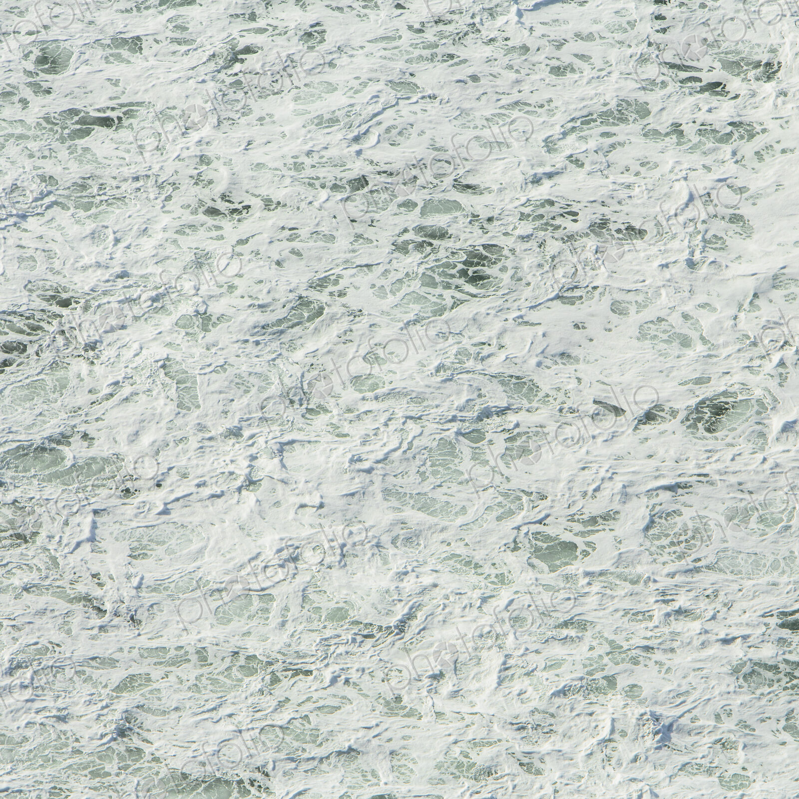 The surface of the Pacific ocean with wave patterns and white water, at Manzanita, Oregon.