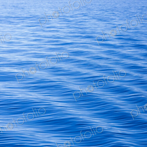 The surface of the ocean, blue water, ripples.