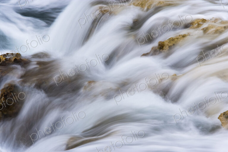The tide flowing over the rocks in Ambergris Cay Island, Turks and Caicos Islands.…