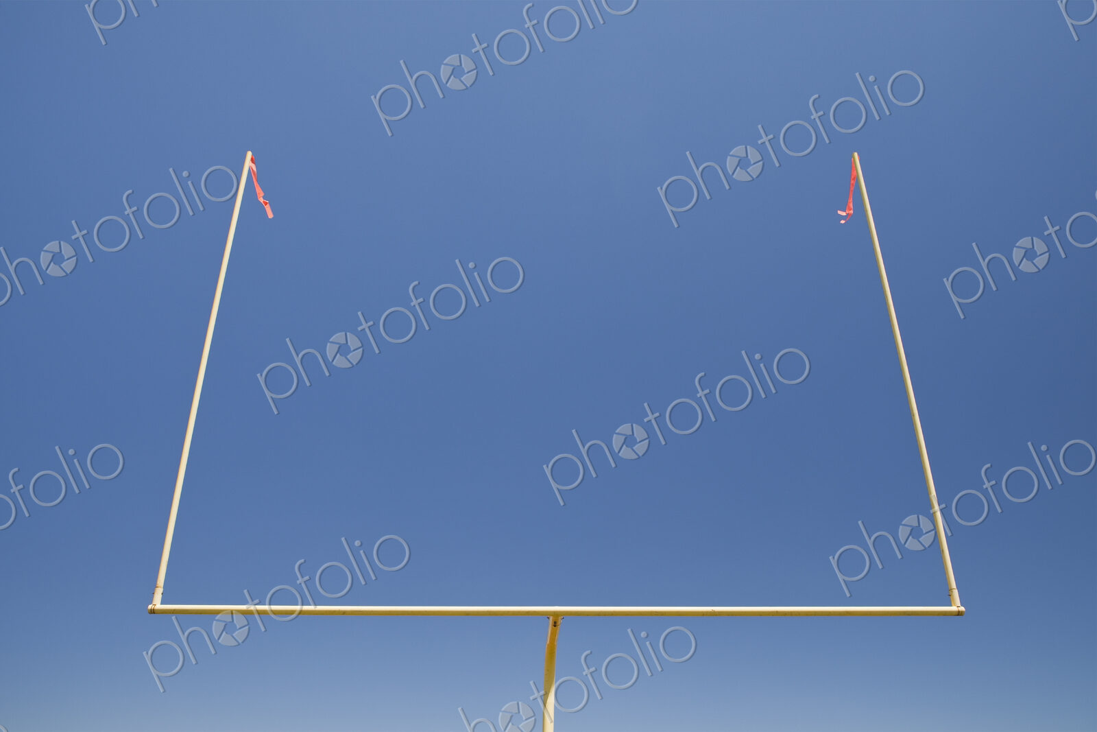 The upright shilouette of the scoring area of Football field goal posts,on a sports field