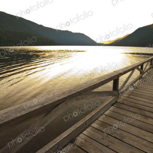 The view at sunset over the water of Lake Crescent, Olympic National Park, Port Angeles The view at sunset over the water of Lake Crescent, Olympic National Park, Port Angeles